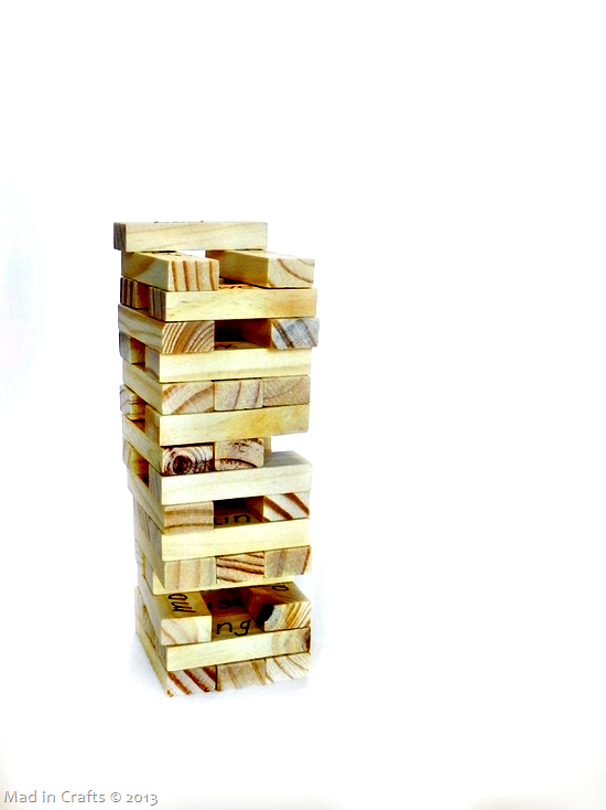 stack of wood Jenga blocks on a white background