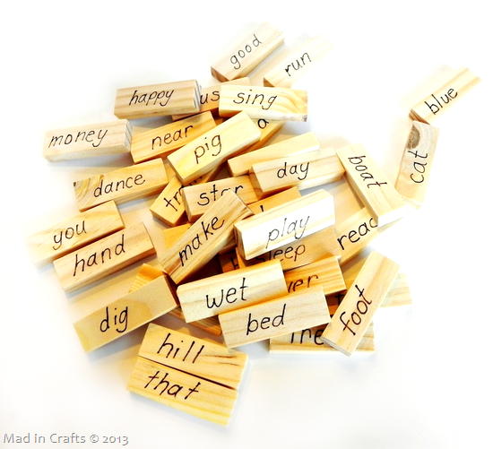 pile of Jenga blocks with words written on them for a reading game