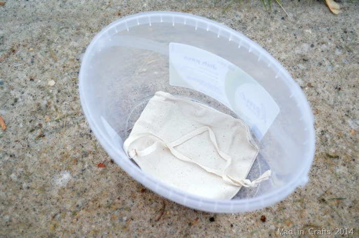 drawstring bag in a small bucket