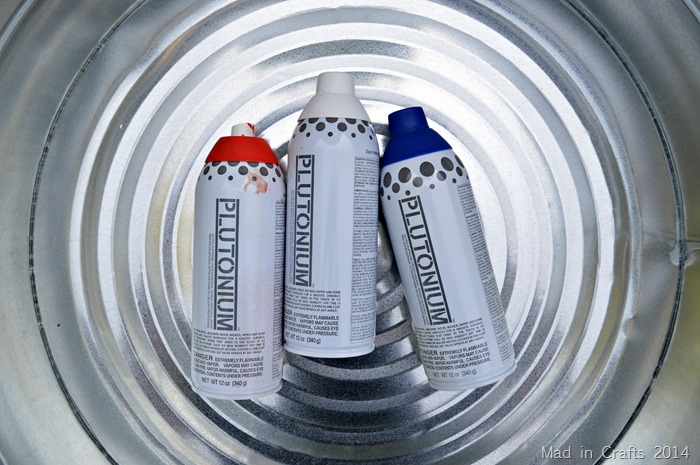 Red white and blue Plutonium spray paint in a galvanized tub