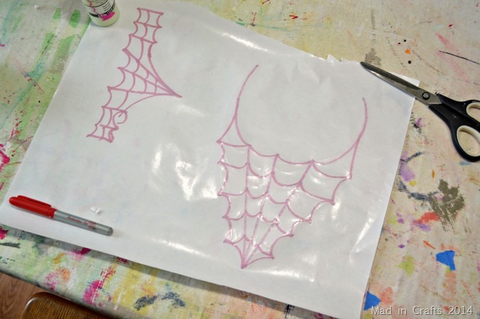 drawings of spider costume accessories on wax paper