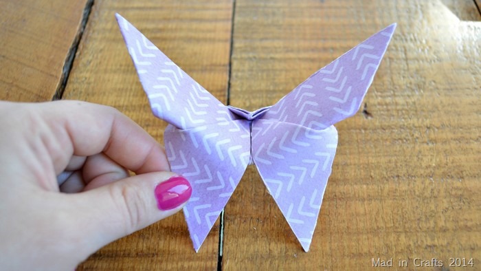 hand holding origami butterfly