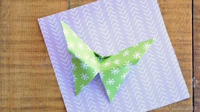 folded origami butterfly with scrapbook paper