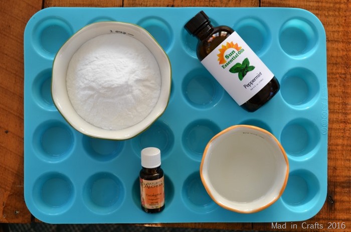 shower melt supplies, silicone pan, baking soda, bowls and essential oils