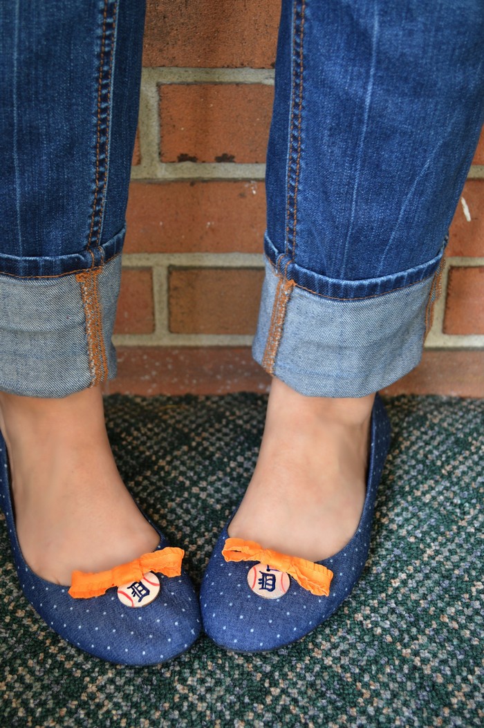 A close up of feet wearing blue shoes