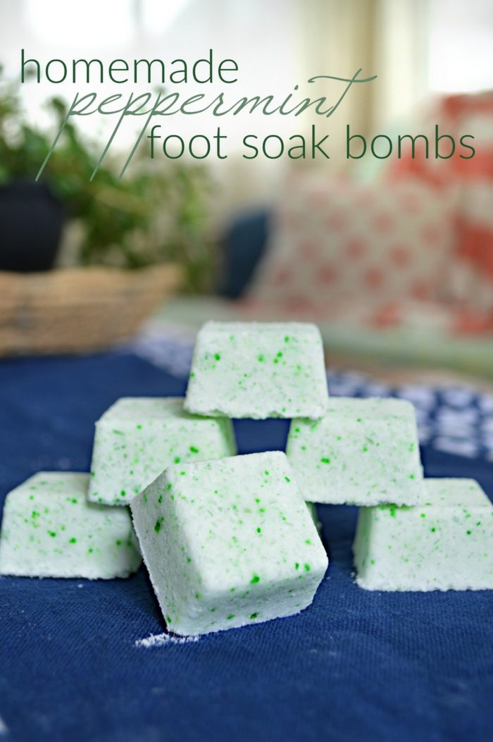 Stack Peppermint Foot Soak Bombs on a blue tablecloth