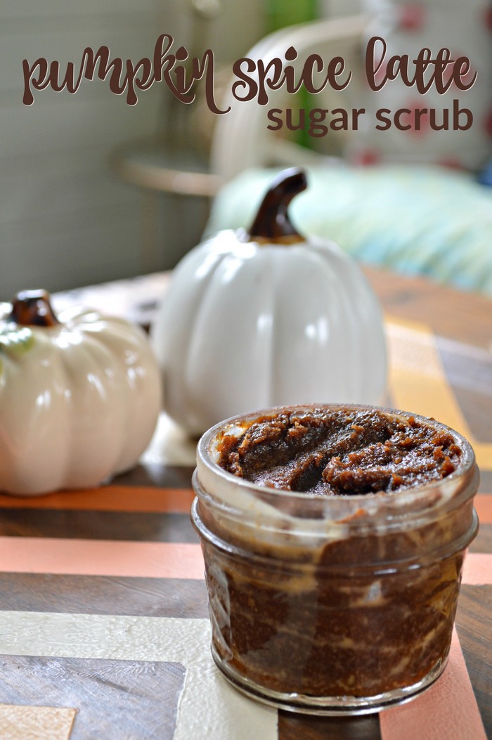 small jar of pumpkin spice sugar scrub on a tray with ceramic pumpkins