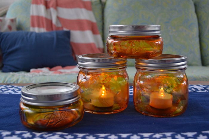 Stacked Pumpkin Mason Jar Luminaries lit with battery powered tea lights