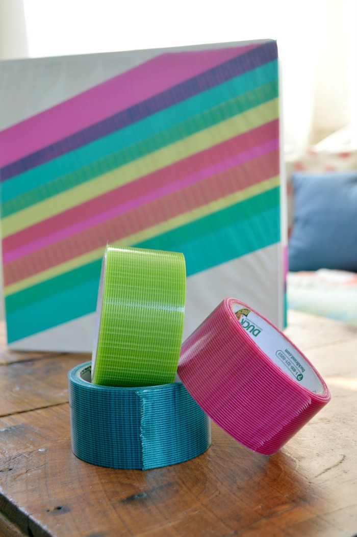 white binder with rolls of colorful transparent duck tape