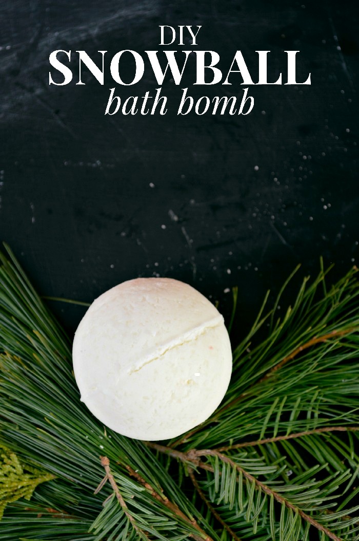 white bath bomb next to pine sprigs