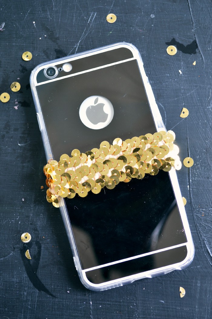 Add a sequin earbud holder to your phone case