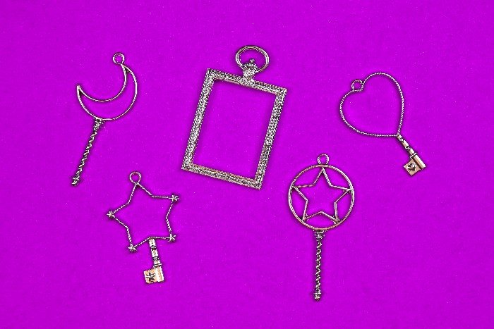 A close up of open backed jewelry bezels
