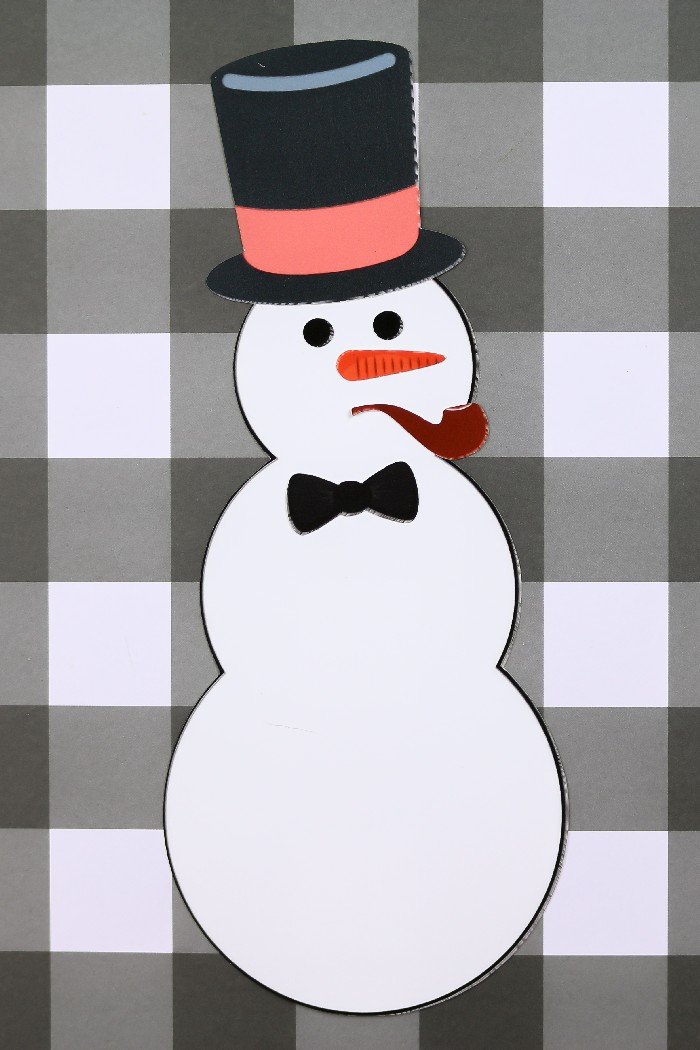 printable snowman paper doll on a plaid background