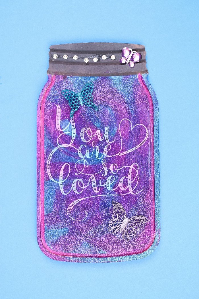 purple and blue mason jar home decor sign embellished with rhinestones and clay butterflies
