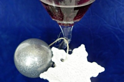 Sangria cocktail in a martini glass with Christmas ornaments