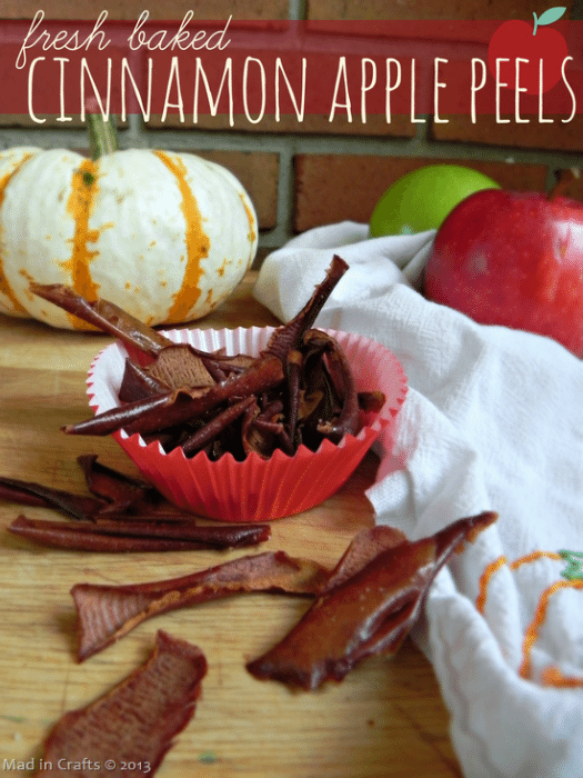 cupcake liner filled with baked apple peels near pumpkins and apples