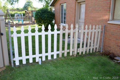 SPRAY PAINTING A PICKET FENCE