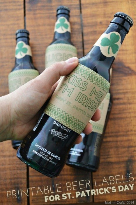 hand holding a bottle of Guinness with a DIY St. Patrick\'s Day beer label