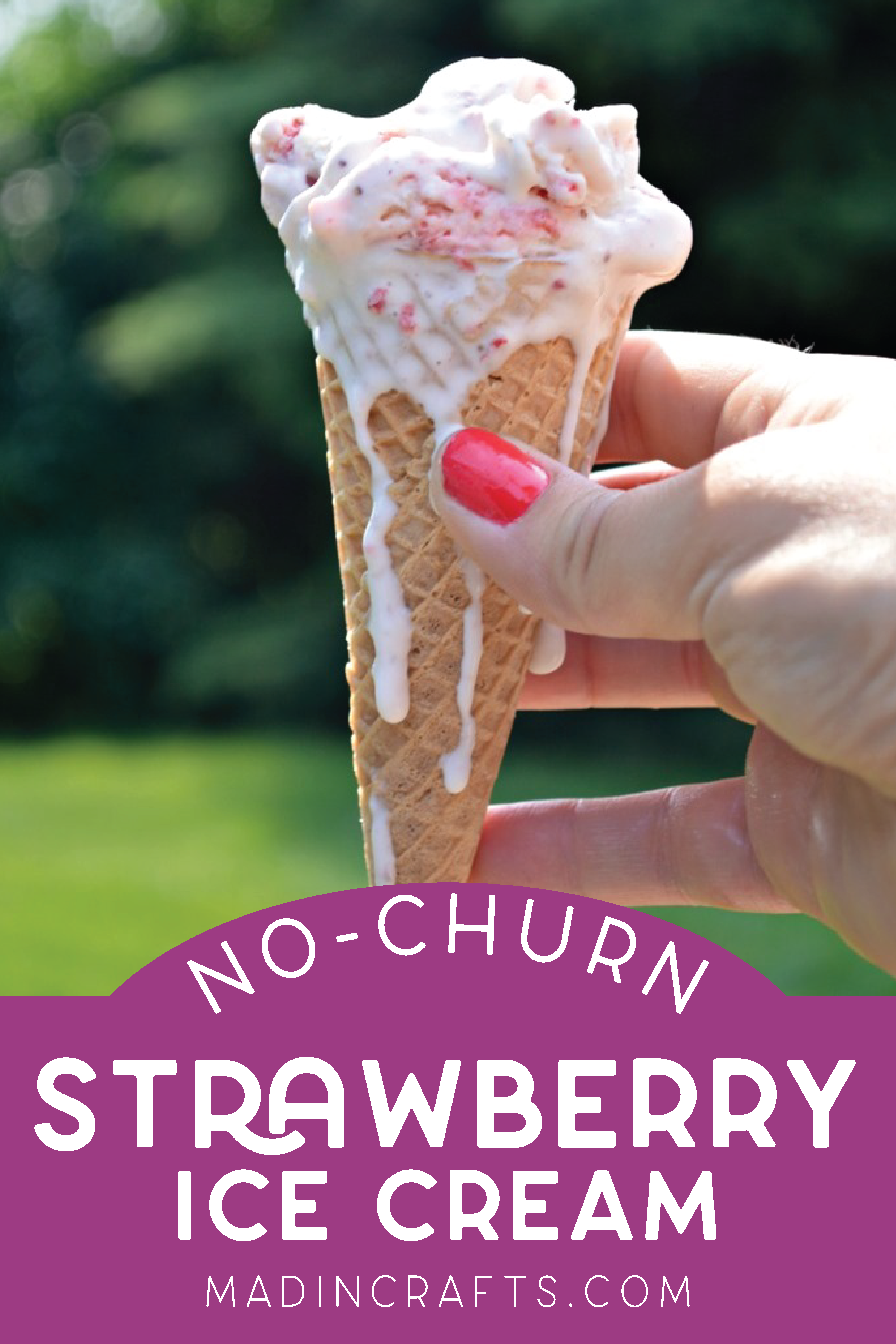 hand holding an ice cream cone of melting strawberry ice cream