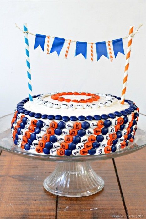 round cake decorated with personalized M&Ms with Detroit Tigers colors and logos