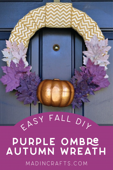 fall wreath with purple leaves and a pumpkin on a blue door