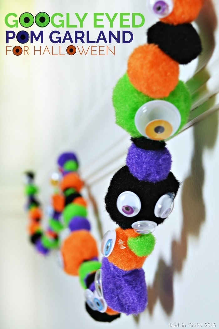 close up of a pom garland with googly eyes