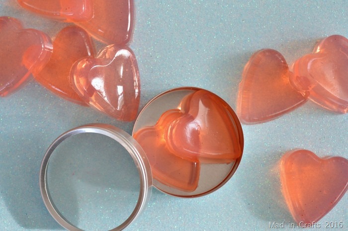 DIY jelly soap shaped like hearts on a blue background