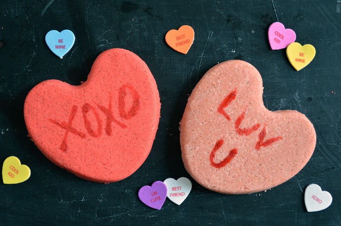 conversation Heart shaped Bath bombs on a black background