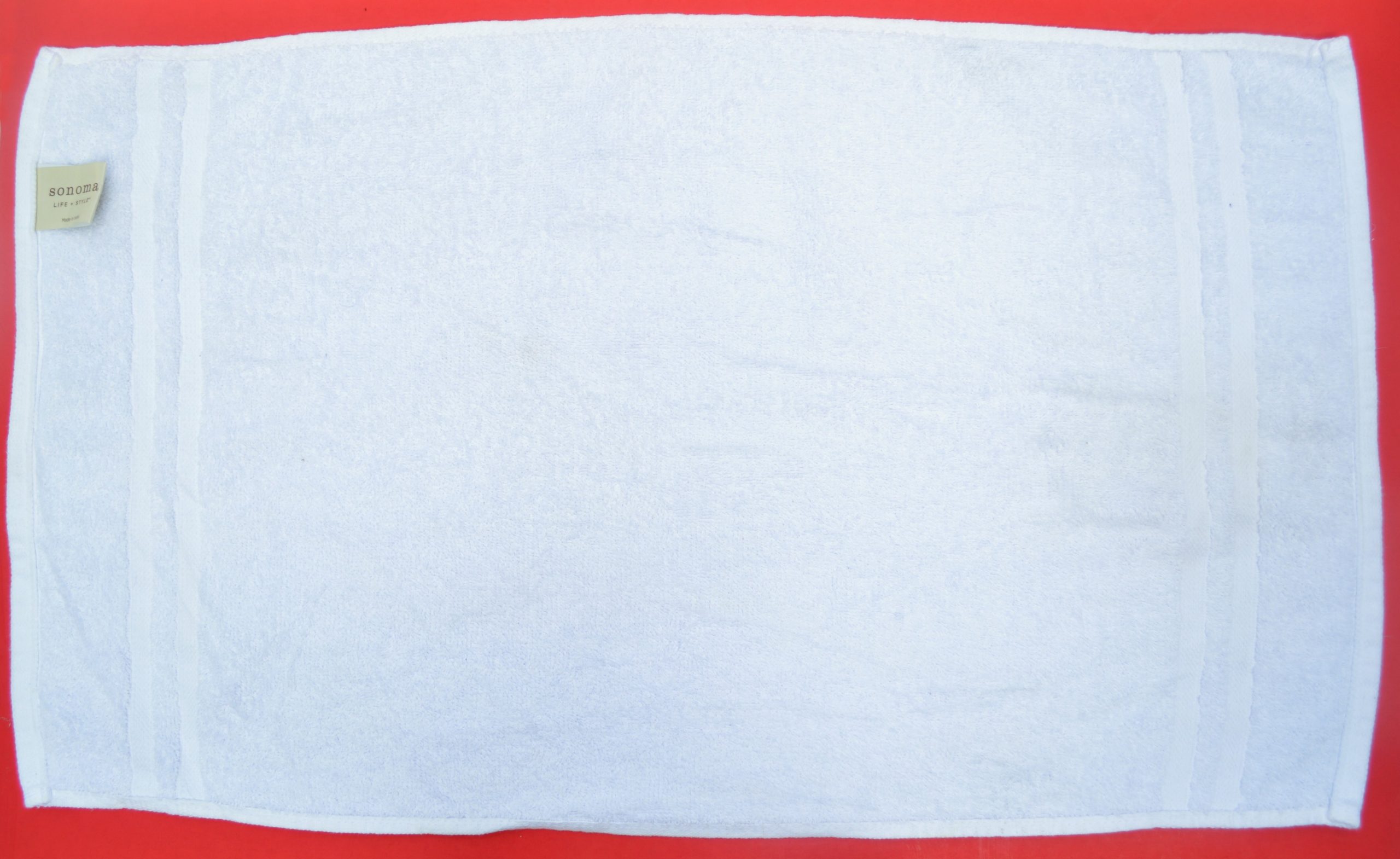 white towel on a red background