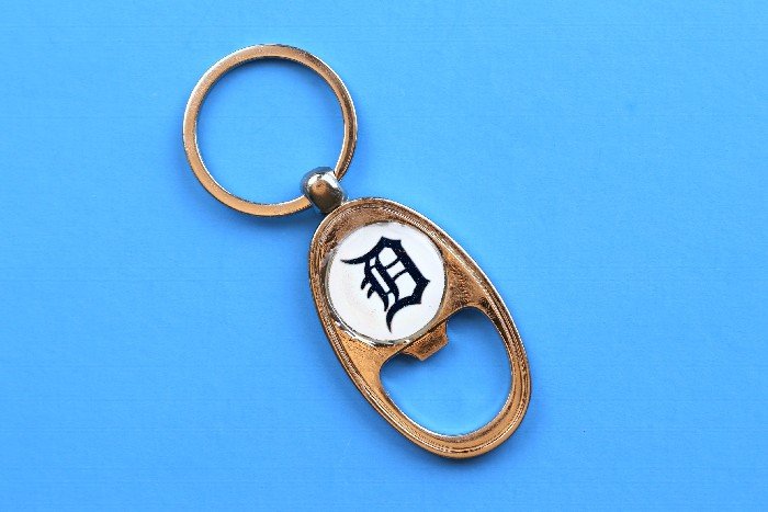 DIY Detroit Tigers bottle opener key chain on a blue background