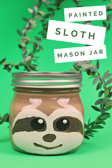 painted sloth mason jar on a green background with vines