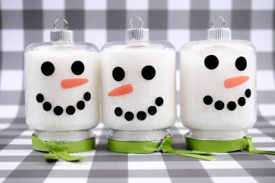 Three mason jar ornaments with vinyl snowman faces