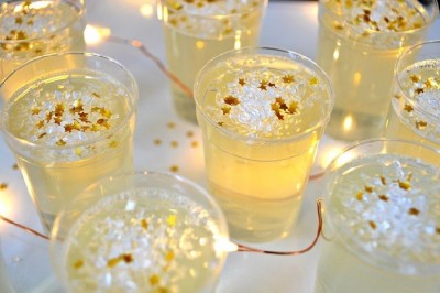 close up of champagne jello shots on a tray