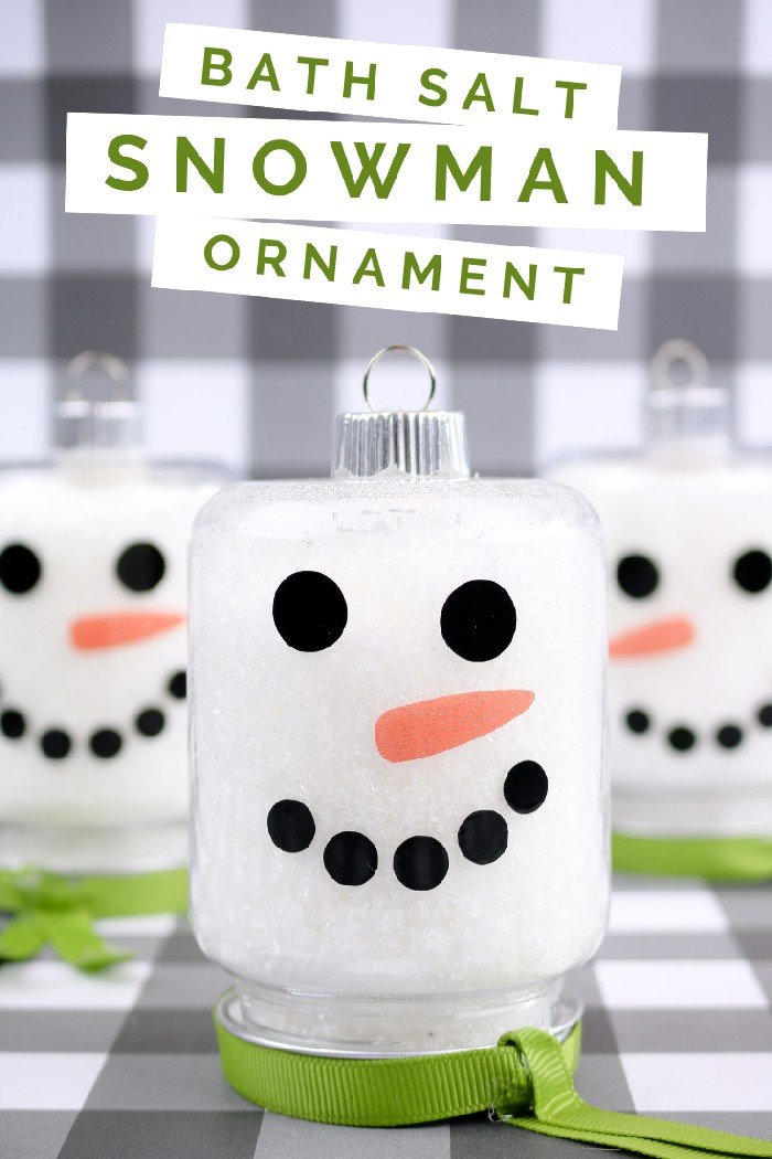 3 snowman mason jar ornaments on a buffalo check background