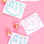 3 printable sloth valentine cards that hold lollipops on a pink background