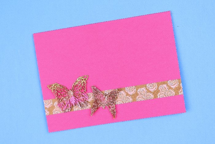 pink handmade card with gold geometric butterfly embellishments
