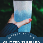woman's hand holding a two toned glitter tumbler