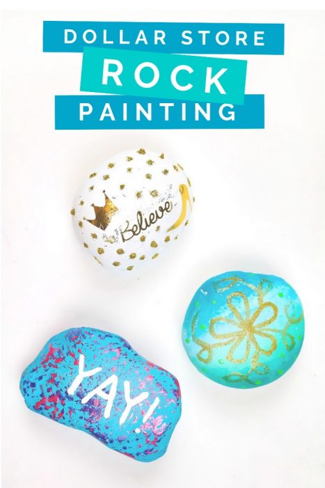 Three painted rocks on a white background