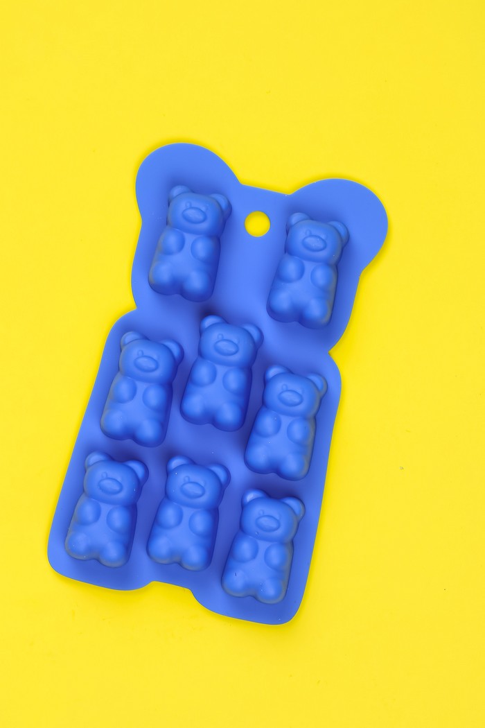 silicone gummy bear mold on a yellow background