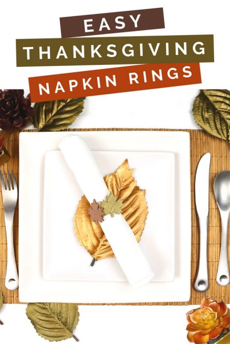 Metallic leaf napkin ring, white napkin, and white plates