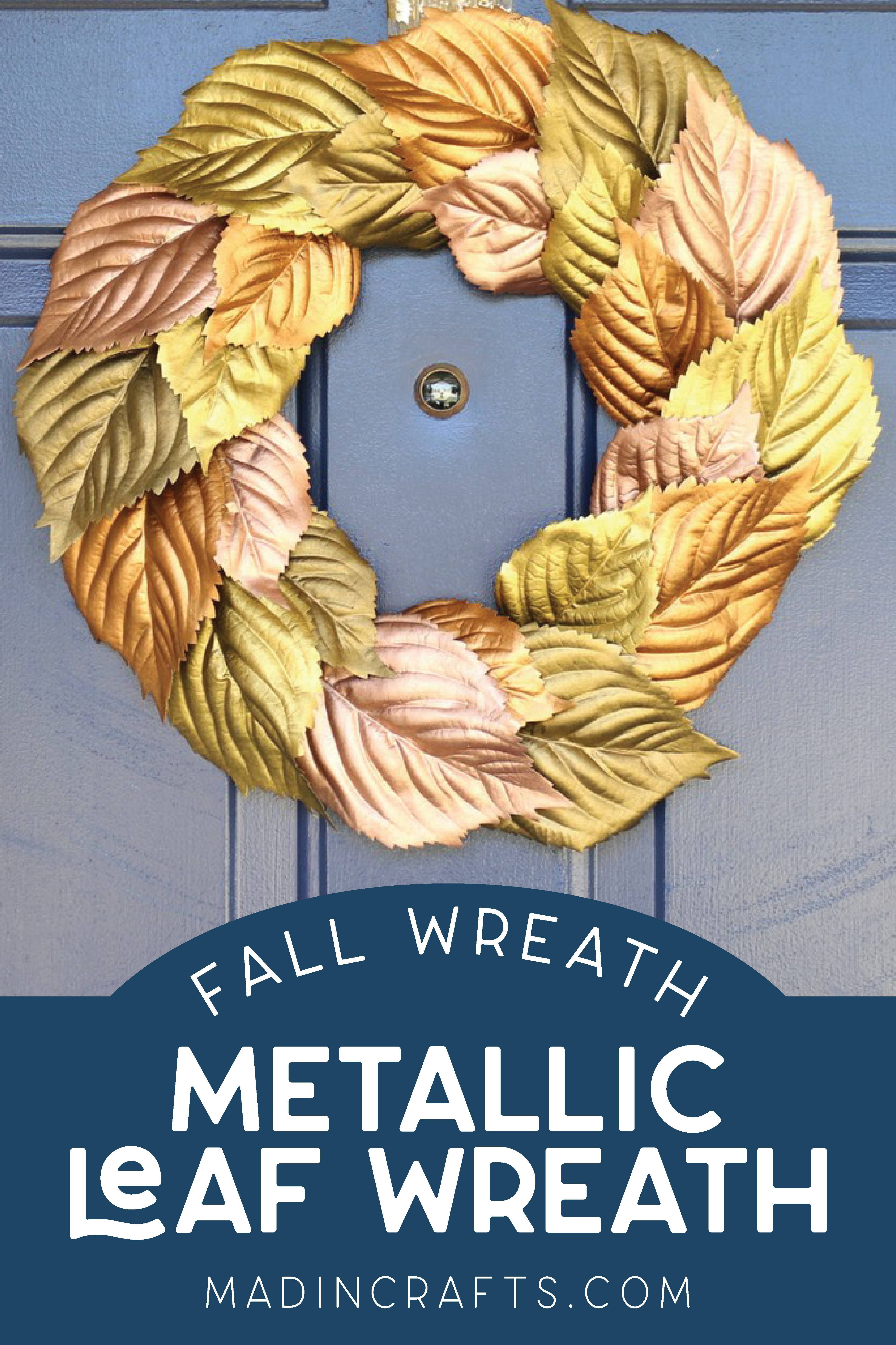 wreath made of metallic leaves on a blue door