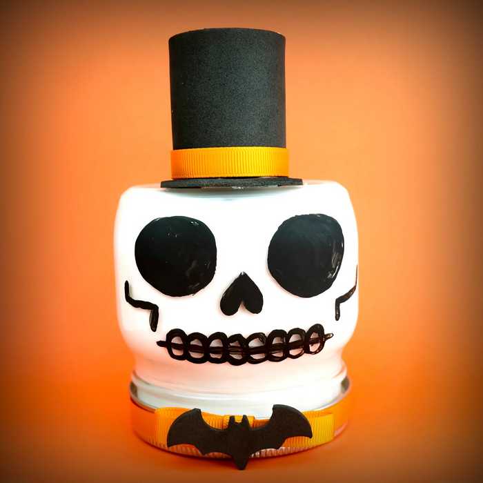 skull mason jar on an orange background