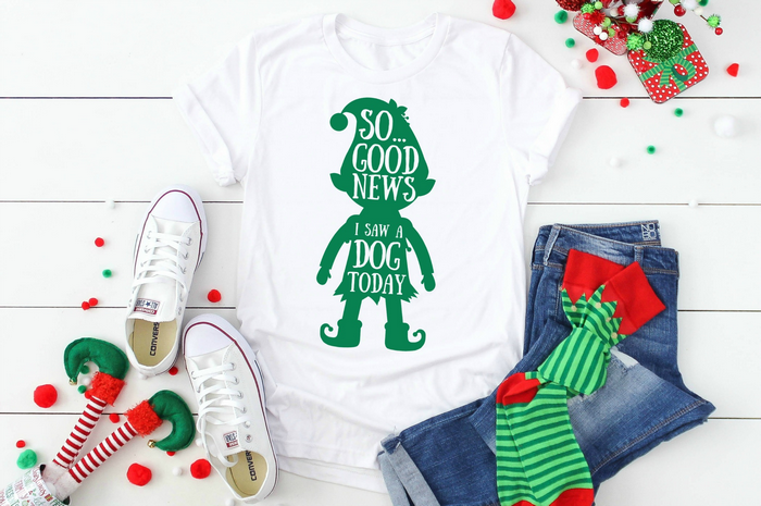 elf quote svg design on a t-shirt near jeans and christmas socks