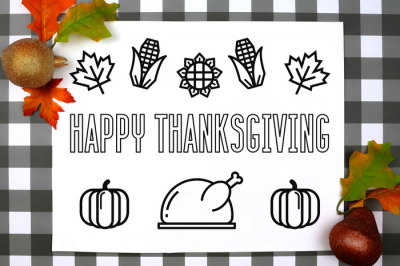 Thanksgiving coloring placemat on a plaid background