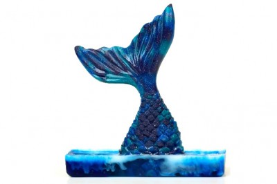 mermaid resin figurine on a white background