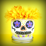 Dia de los Muertos skull mason jar on a yellow background