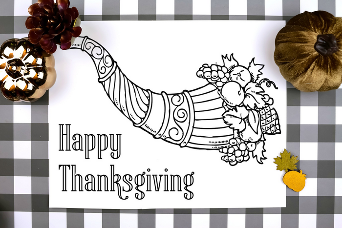 thanksgiving coloring page placemat on a plaid background