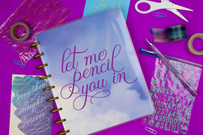 planner with vinyl that reads Let Me Pencil You In next to journalling supplies