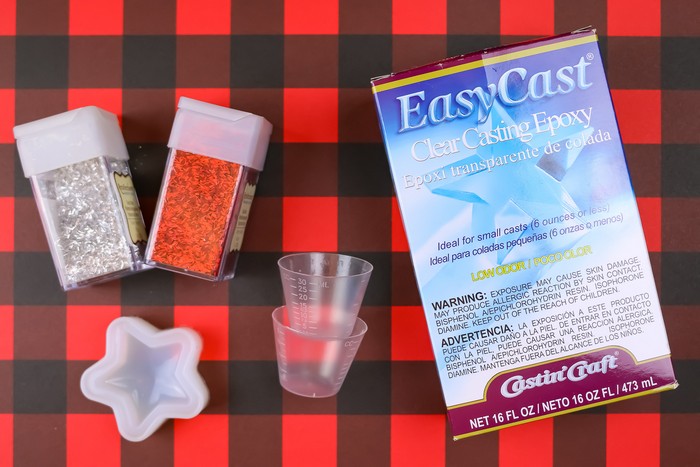 Casting epoxy supplies on a plaid background