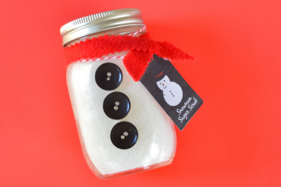 snowman mason jar with tag on a red background
